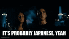 a man and a woman are standing next to each other with the words " it 's definitely japanese " on the screen