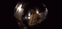 a blurry picture of a couple dancing in a dark room .
