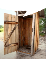 a wooden outhouse with its doors open and a toilet inside