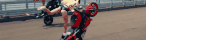 a woman is doing a trick on a motorcycle with her legs crossed
