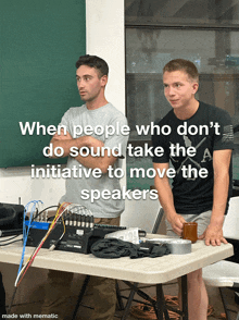 two men standing next to a table with a caption that says when people who don 't do sound