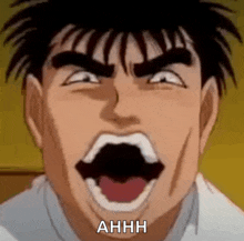 a close up of a man 's face with his mouth open and the words ahhh written below him