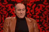 a man in a brown leather jacket says " it 's not rocket science mate ! "