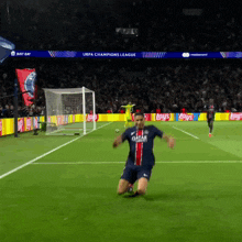 a soccer player wearing a qatar shirt is kneeling down on the field