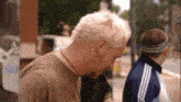 a man with a headband on his head looks down