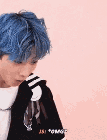 a close up of a person with blue hair .