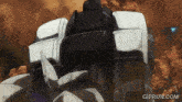 a gif of a robot with the website gifrun.com in the lower right corner