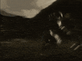 a silhouette of a person jumping in the air with a sword