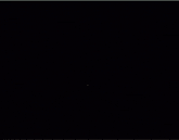 a close up of the wb logo on a dark background