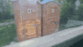 two portable toilets one for men and one for women are sitting next to each other