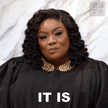 a woman in a black gown says it is in white letters