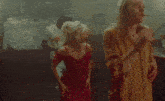 a man and a woman are dancing together in a dark room