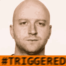 a picture of a bald man with the words #triggered below it