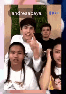 a group of people are posing for a picture with the name andreaabaya on the bottom right