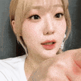 a close up of a woman 's face with blonde hair