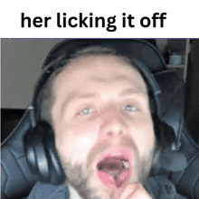 a man wearing headphones with his mouth open and the words her licking it off below him