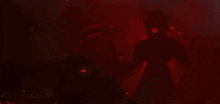 a silhouette of a robot with a red light around it