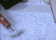 a man with a beard is smoking a cigarette while sitting at a table .