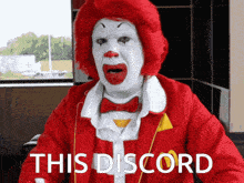 a mcdonald 's clown says " this discord " in white letters
