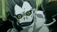 a close up of a cartoon character with a monkey face and a skull on his chest .