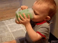 Baby Drinking GIF - Baby Drinking Spill GIFs