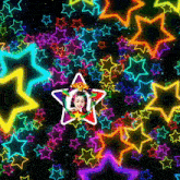 a girl in a star surrounded by glowing stars