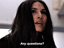 a woman with a dirty face says " any questions "