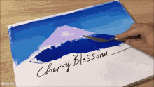 a painting of a mountain with the word cherry blossom written on the bottom