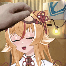a hand is touching the head of a blonde anime girl wearing goggles
