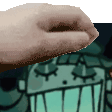 a close up of a person 's hand holding something in front of a cartoon character .