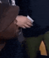 a close up of a man wearing a hat and making a funny face .