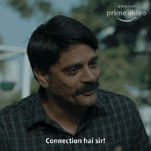 a man with a mustache says 