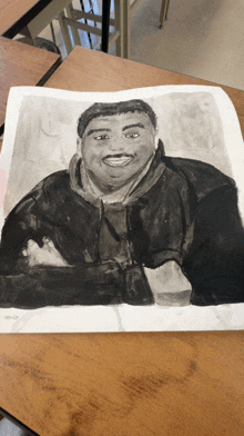 a black and white drawing of a man sitting on a table