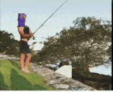 a man is fishing with a minecraft head on his head
