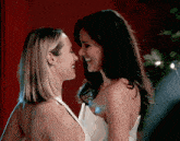 two women are looking into each other 's eyes