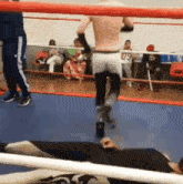 a man in a boxing ring with the number 79 on his pants