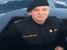 a man in a black uniform with the name villarroel on his chest