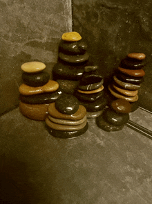 a group of rocks stacked on top of each other on a black surface