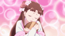 a girl with a flower in her hair is hugging a mirror
