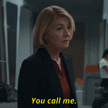 a woman in a suit says " you call me " in yellow letters