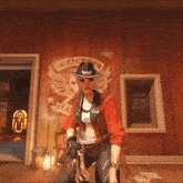 a woman in a cowboy hat is holding a gun in a room .