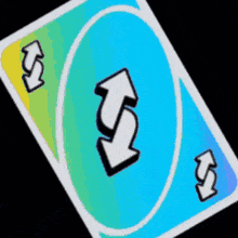 a blue and yellow uno card with arrows on it