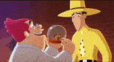 a man in a yellow hat is holding a snow globe with a house inside of it