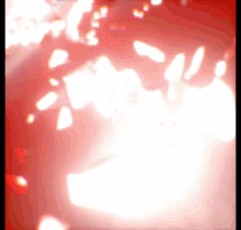a red background with a white glowing object in the center