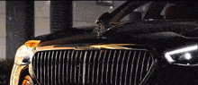 a maybach car is parked in a dark room