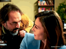 a man and a woman are looking at each other with the words kanald.com.tr in the upper right corner