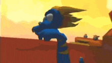 a blue dragon is standing in a desert with a yellow sky in the background .