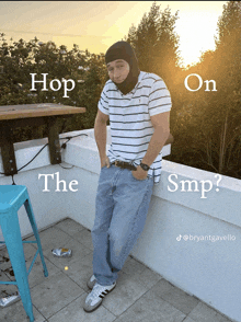 a man standing on a balcony with the words hop on the smp on the bottom