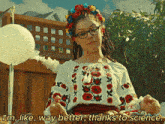 a woman wearing a floral headband and glasses says i 'm like way better thanks to science