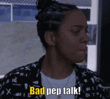 a woman says bad pep talk while wearing a black shirt